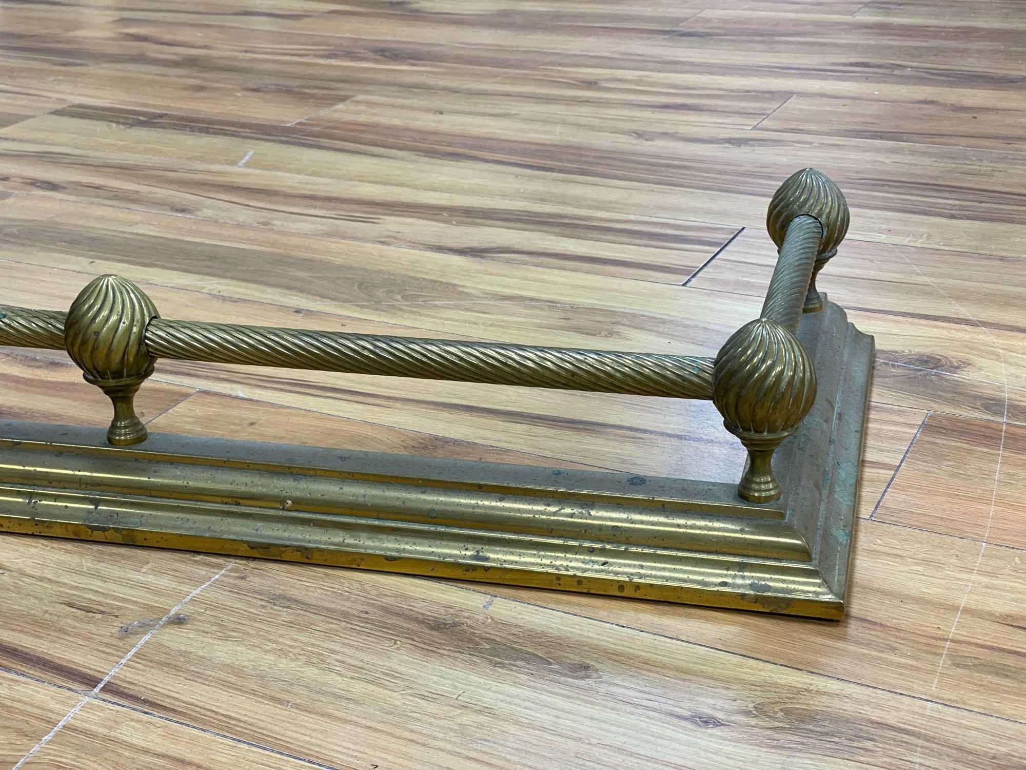 A Victorian brass kerb, length 133cm
